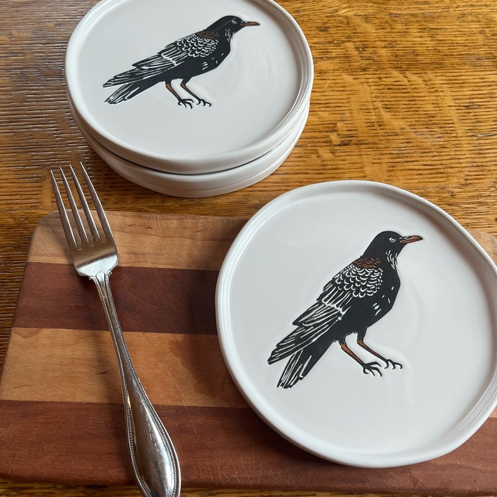 Set of four dessert plates. Threshold brand with Raven.